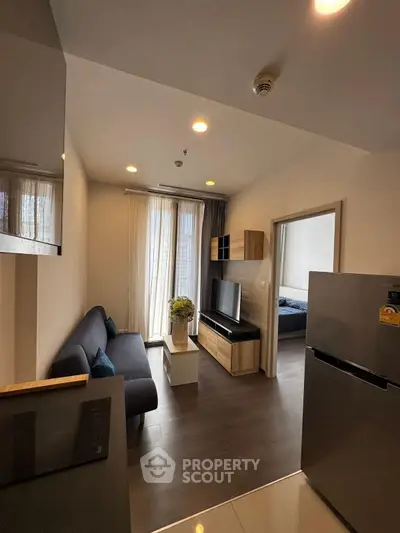 Modern living room with sleek furniture and natural light