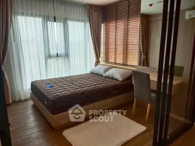 Modern bedroom with large windows and stylish decor