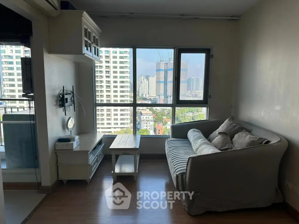 Cozy living room with city view and modern furnishings