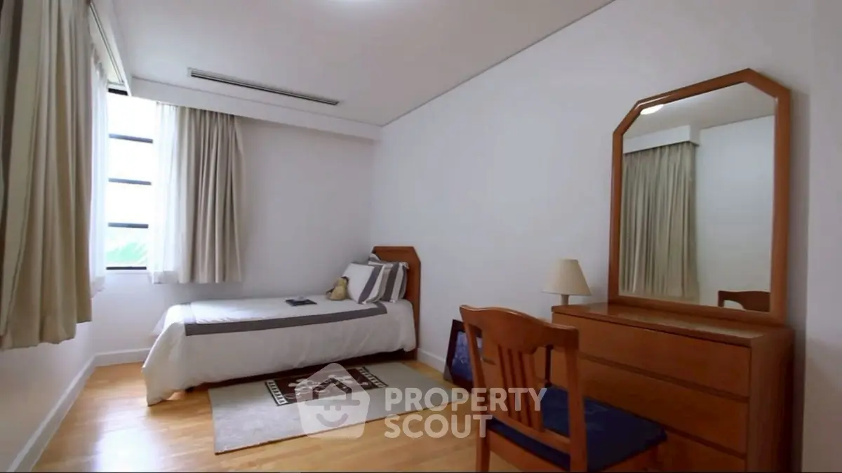 Cozy bedroom with wooden furniture and natural light