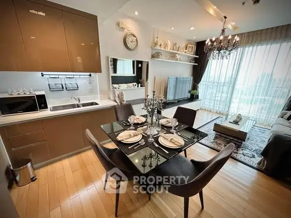 Modern open-plan kitchen and living room with elegant dining area and large windows.