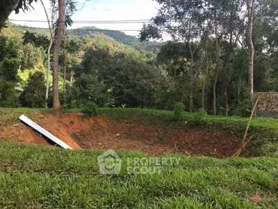 Scenic view of a lush green landscape with a large excavation site, ideal for future development.