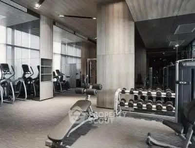 Modern gym with state-of-the-art equipment in luxury residential building.