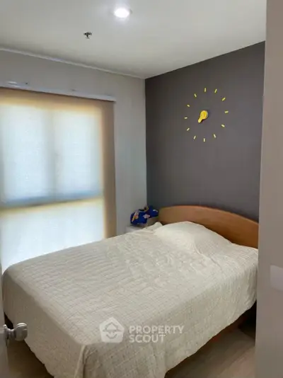 Cozy bedroom with modern decor and natural light