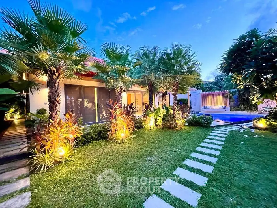 Luxurious tropical villa with lush garden and private pool, perfect for serene living and entertaining.