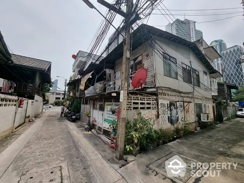 Authentic vintage townhouse nestled in a local urban alley, offering a unique fixer-upper opportunity for investors or a charming abode for city dwellers.