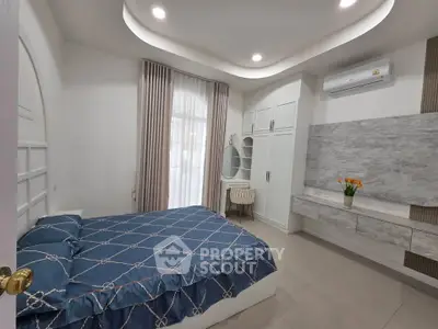 Modern bedroom with stylish decor and natural light