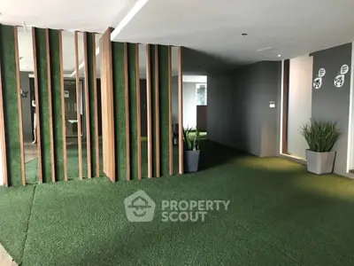 Modern building interior with green carpet and stylish decor