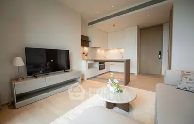 Modern open-plan living room with sleek kitchen and stylish decor