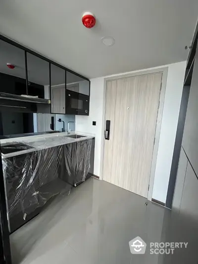 Modern kitchen with sleek cabinets and glossy floor in a contemporary apartment