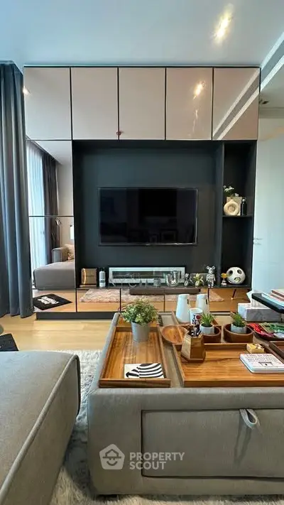 Modern living room with sleek entertainment center and cozy decor
