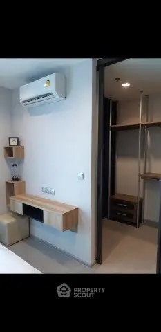 Modern bedroom with built-in desk and walk-in closet