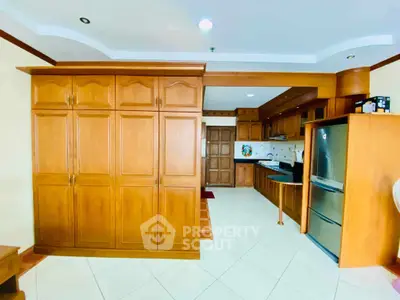 Spacious kitchen with wooden cabinets and modern appliances