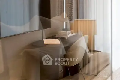Modern living room with sleek furniture and soft lighting, perfect for relaxation and reading.