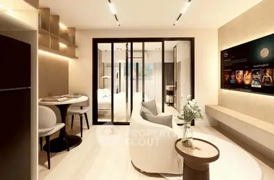 Modern open-plan living room with elegant decor and sliding glass doors leading to a cozy bedroom.