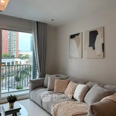 Modern living room with cozy sofa and city view from large window