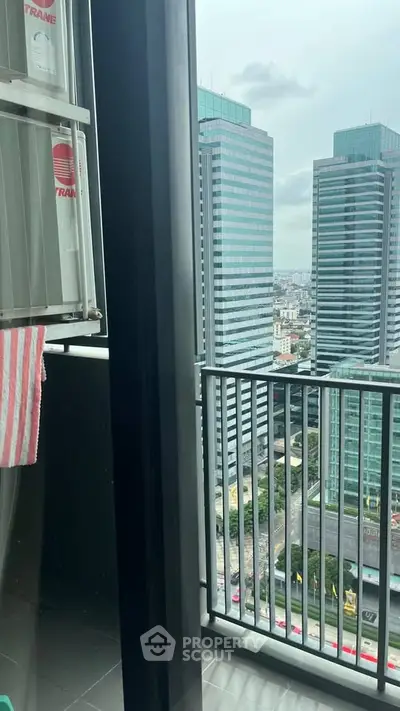 Stunning city view from a modern high-rise balcony, perfect for urban living.