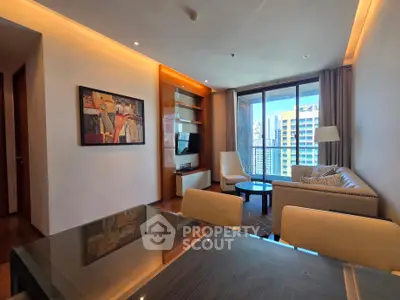 Modern living room with city view, elegant furniture, and stylish decor in a high-rise apartment.