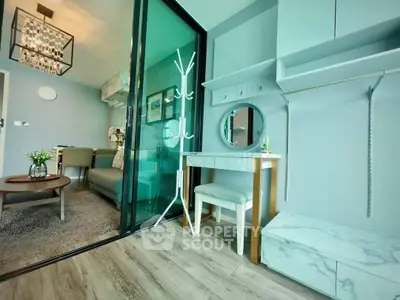 Modern apartment interior with stylish living room and chic vanity area, featuring elegant decor and open layout.