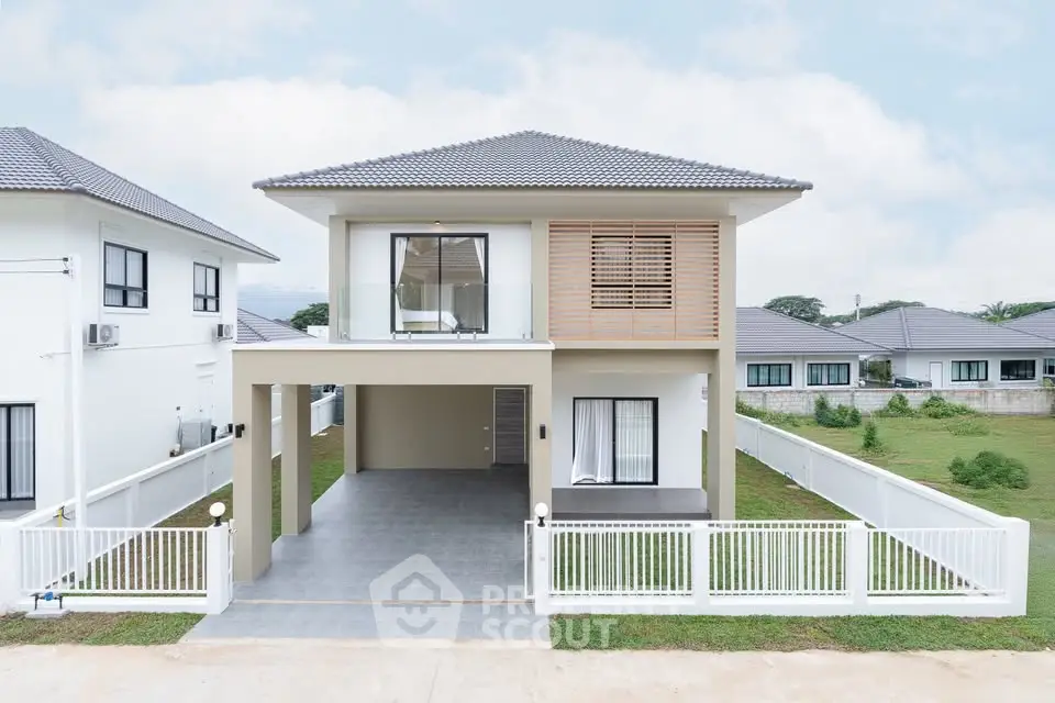 Modern two-story house with spacious driveway and elegant design