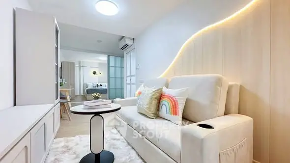 Modern living room with cozy sofa and stylish decor in a bright apartment.