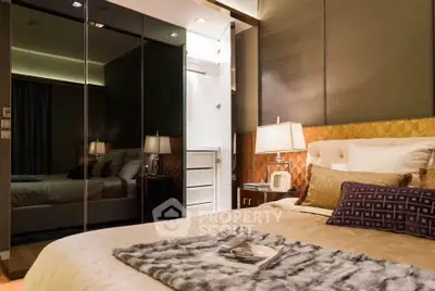 Luxurious bedroom with elegant decor and mirrored wardrobe doors