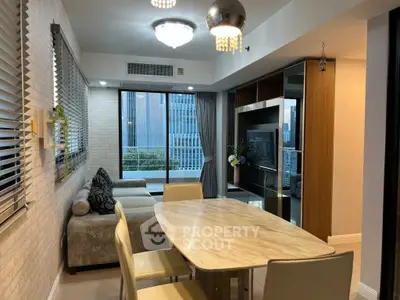 Modern living room with city view, stylish furniture, and elegant lighting