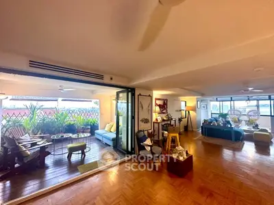 Spacious living room with open balcony and stylish decor