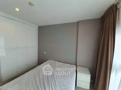 Modern bedroom with minimalist design and ample natural light