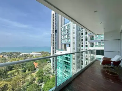 Stunning high-rise balcony with ocean view and modern cityscape, perfect for urban living.