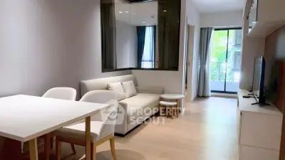 Modern living room with sleek furniture and balcony view in a stylish apartment.