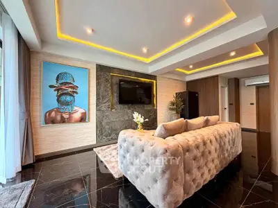 Luxurious living room with modern decor and plush seating in a stylish apartment.