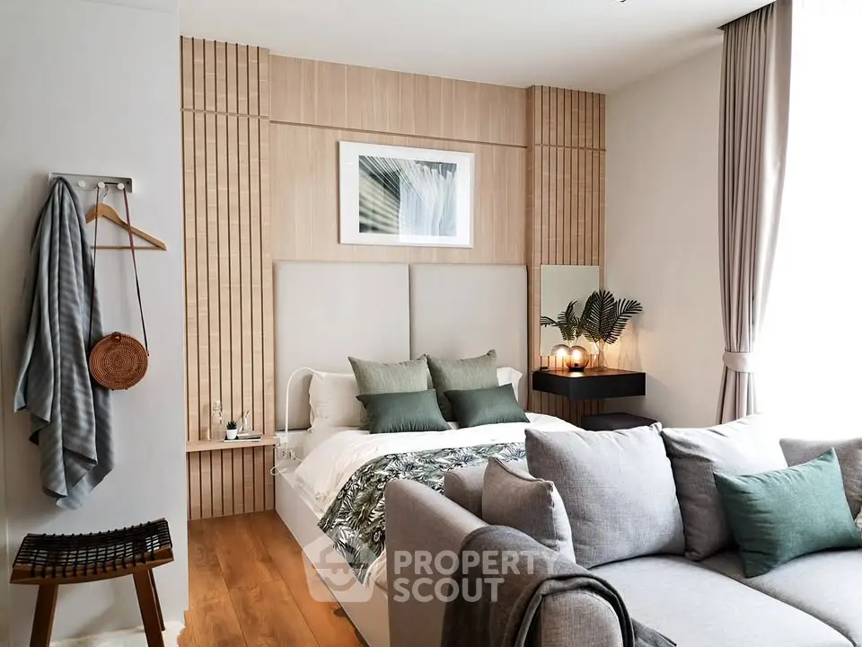 Stylish modern bedroom with cozy seating area and elegant decor