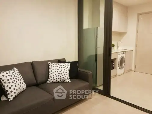 Modern apartment interior with cozy living room and sleek kitchen area
