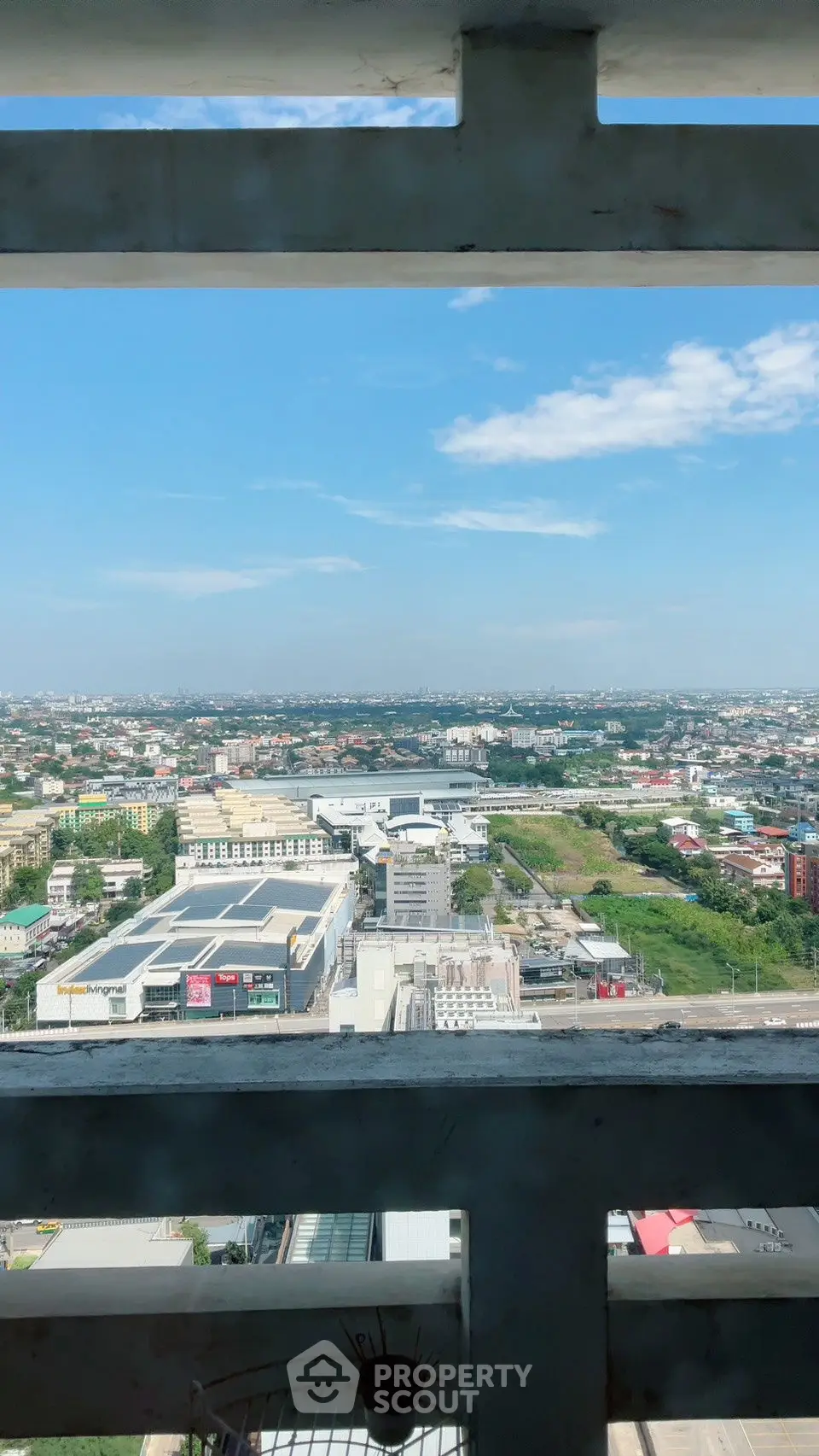 Stunning panoramic city view from high-rise building balcony