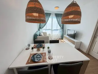 Chic living room with modern dining area and natural light, perfect for cozy gatherings.