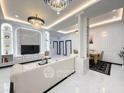 Luxurious modern living room with elegant chandeliers and stylish dining area