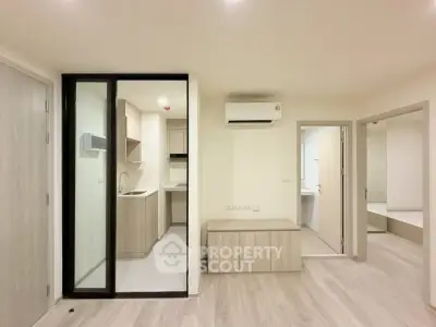 Modern apartment interior with open layout and sleek kitchen design