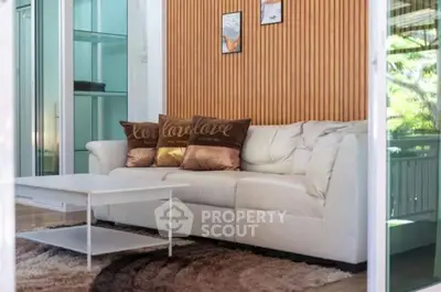 Stylish living room with modern white sofa and chic decor