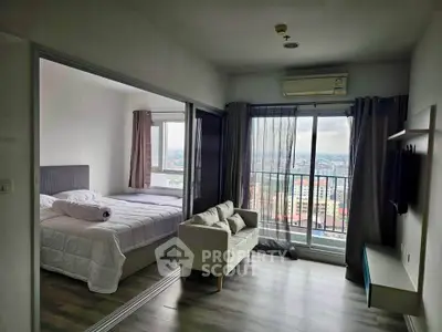 Modern apartment with bedroom and living room, featuring large windows and city view.