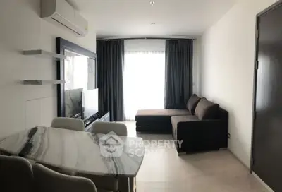 Modern living room with marble dining table and cozy sofa in stylish apartment.