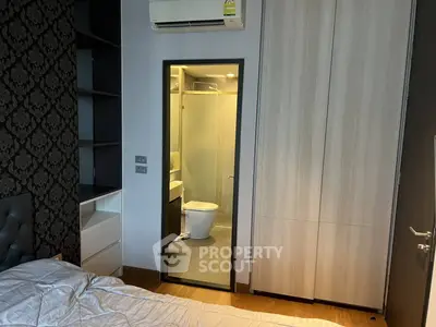 Modern bedroom with ensuite bathroom and stylish decor