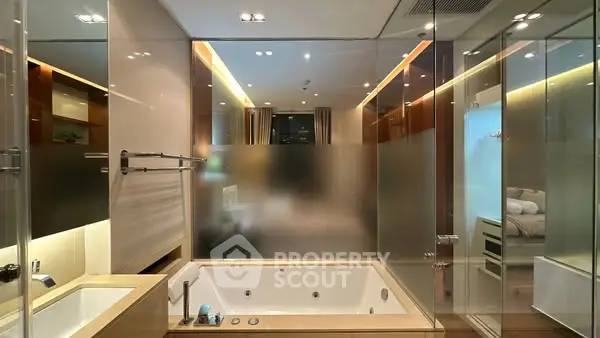 Luxurious modern bathroom with glass walls and built-in bathtub