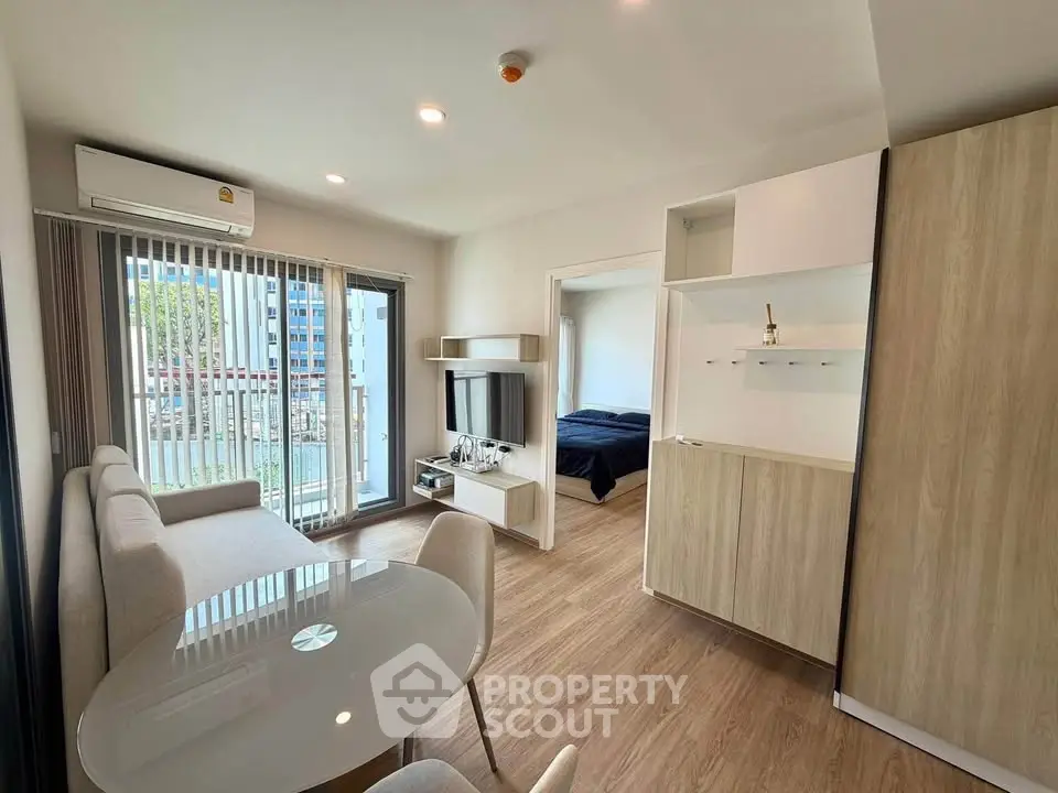 Modern living room with open layout and balcony view in a stylish apartment