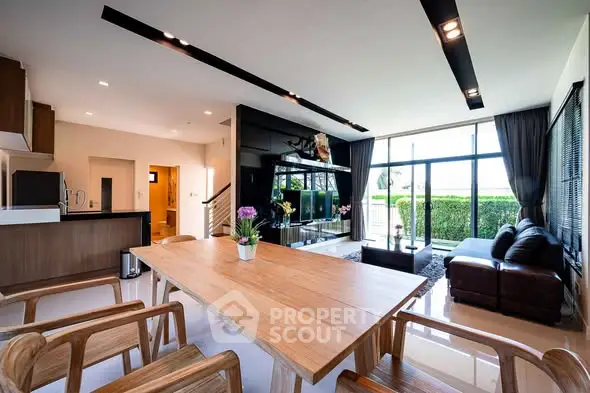 Spacious modern living room with open layout and garden view