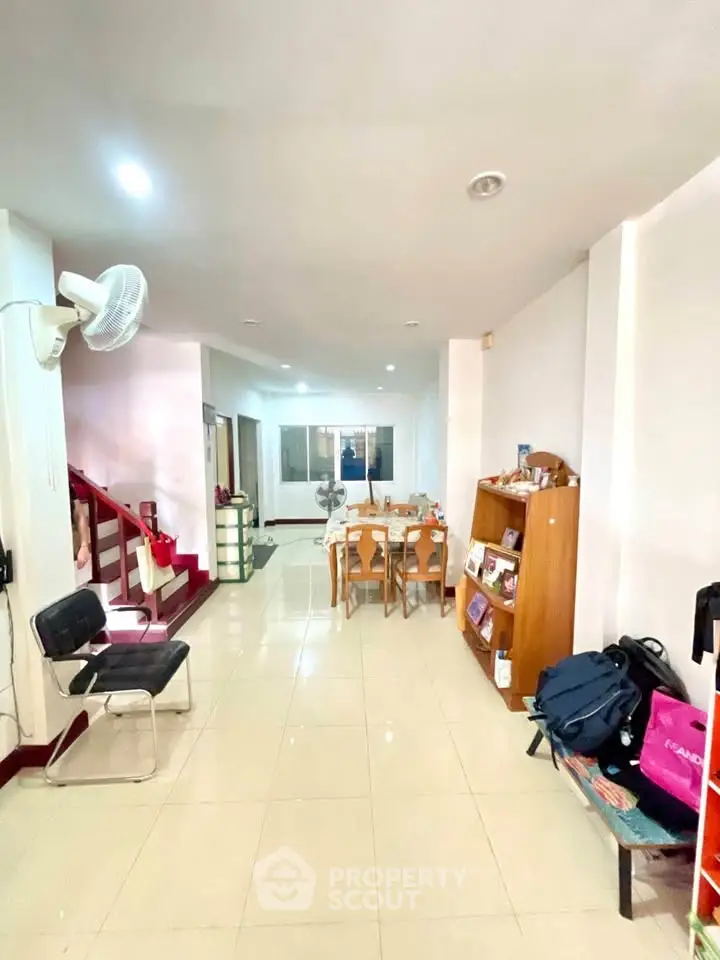 Spacious living room with modern decor and open layout, perfect for family gatherings.