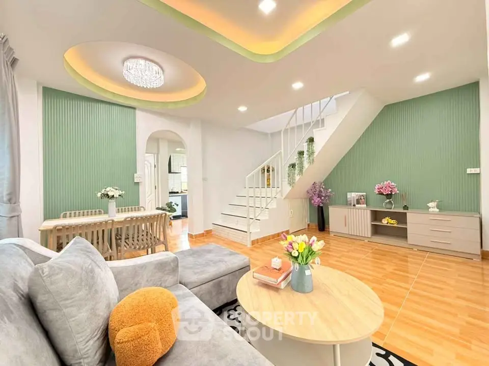 Modern living room with stylish decor and staircase in a cozy home