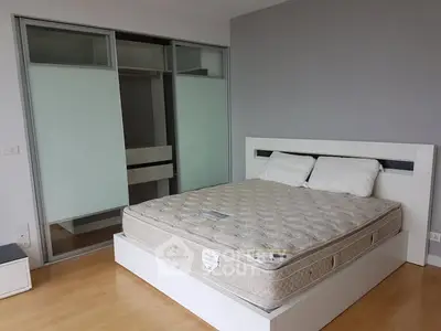 Modern bedroom with sleek design and spacious wardrobe