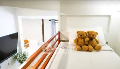 Charming bedroom with cozy loft bed and plush teddy bears, perfect for a child's dream room.