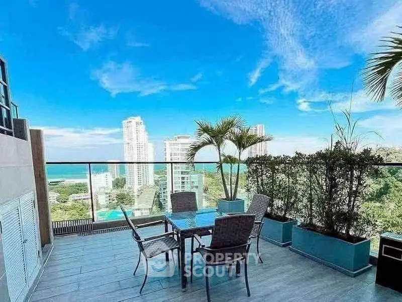 Stunning rooftop terrace with panoramic city views and modern outdoor furniture.
